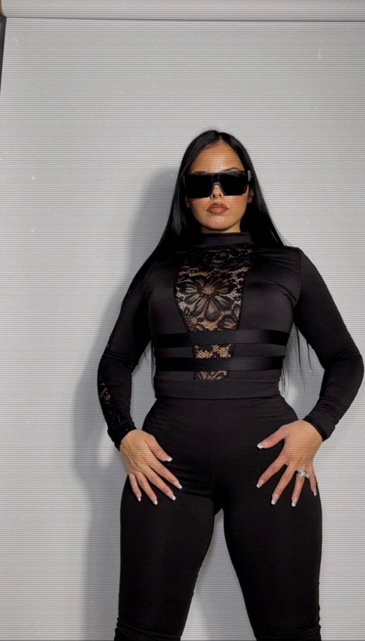 Black laced catsuit